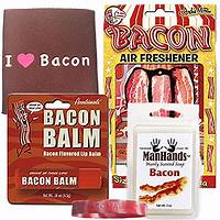 Various bacon-themed novelty items, including a lip balm, air freshener, soap, bracelet, and a brown sleeve with "I ♥ Bacon" printed on it are displayed together.