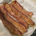 bacon cooked in the oven with parchment paper.